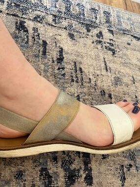 well worn white sandals